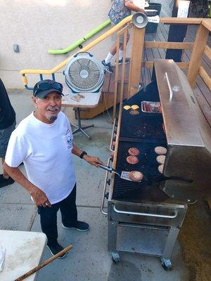 Art Grilling up some of his famous burgers.