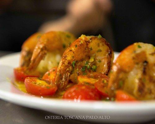 GAMBERONI- grilled jumbo prawns, tomato, garlic, and turmeric