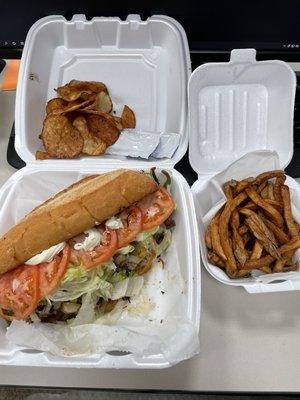 Steak hoagie, chips and fresh cut fries.