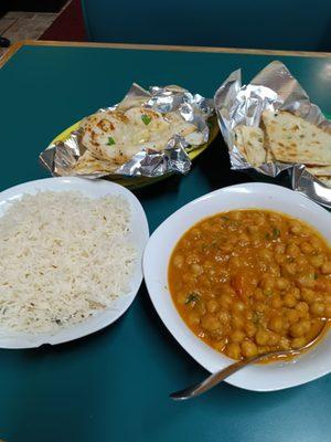 Chana Masala, onion naan, garlic naan, and rice.