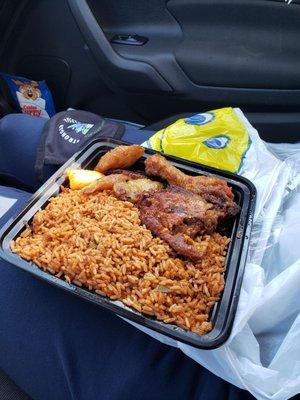 Jollof rice with chicken & plantains.