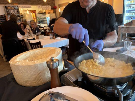 Paola the owner preparing Cacio e Pepe tableside.