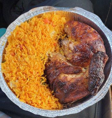 1/2 Peruvian Rotisserie Chicken. Ordered it with yellow rice and  a side of red beans. The yellow rice is like a fried rice. Very tasty.