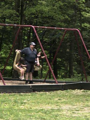 Granddaughters loving the swings.