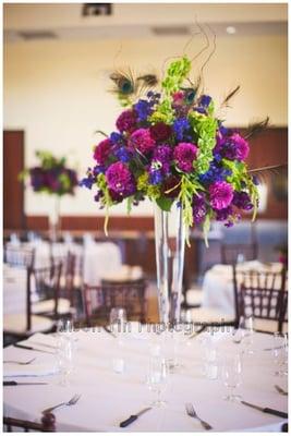 During set up before the wedding: you can see the table set up, chairs and room (architecture)