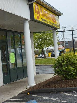 View of storefront from parking.