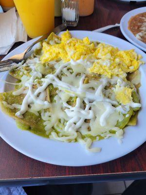 Now serving breakfast.  Chilaquiles Verdes (green) served with rice & beans.