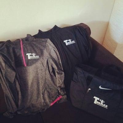 Women's pullover, unisex zip up jacket, and gym bag