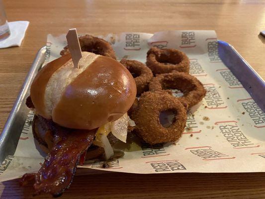 Bacon cheese burger with onion rings.