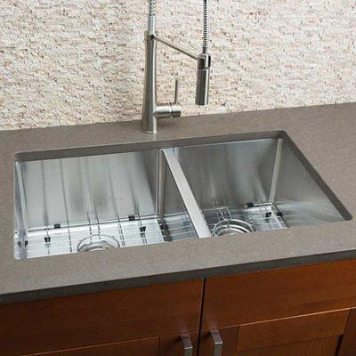 Kitchen sink installs. Hahn's double sink with high arc pull out faucet. Strainers included.