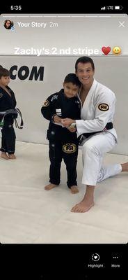 My little one at jiu jitsu class .