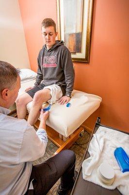 Astym Therapy being performed on a running injury