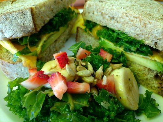 Egg and cheese breakfast sandwich with kale, banana, strawberry, salad. It was soooo good!