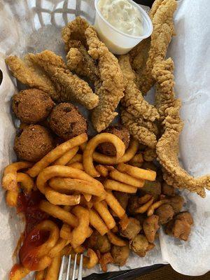 Catfish with curly fries and okra plus the hush puppies it comes with.