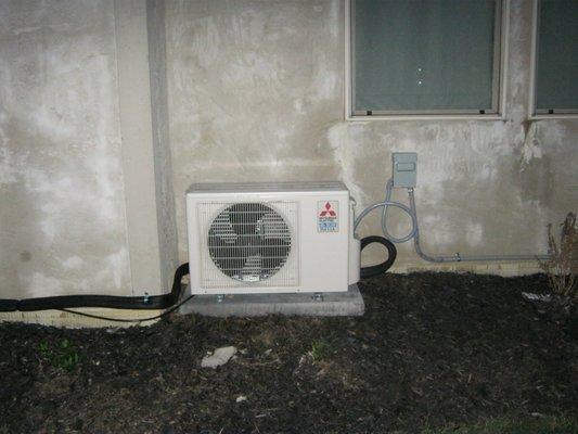 High-efficiency Mitsubishi ductless mini split that's both air-conditioner and heat pump installed for an enclosed insulated outdoor patio.