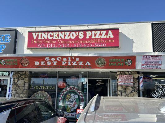 Front of the shop. Get your pizza here, you won't regret it!