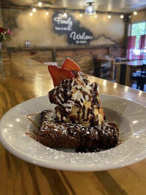 Homemade chocolate brownie with ice cream and homemade whip cream