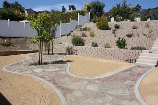 Concrete curb containing flagstone walkway