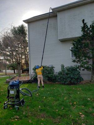 Using our SkyVac machine which makes high level cleaning safe, efficient, and economical.