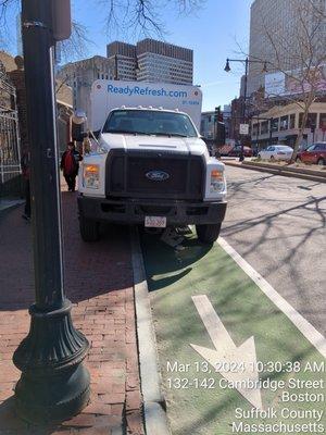 illegal parking on sidewalk and bike lane