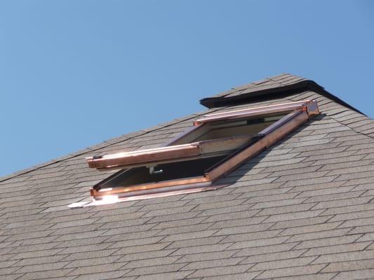 Copper clad Velux operable skylight installed in a historical home