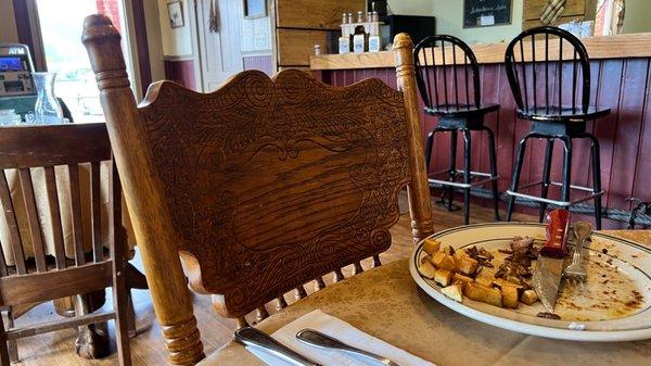 Handcarved chairs. Charming old school place.