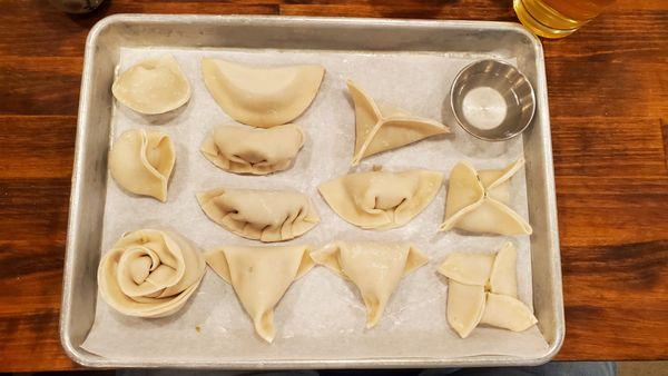 My dumpling folding skills on display. Prior to cooking.