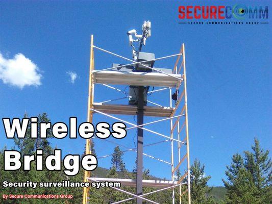 Wireless security camera bridge installation at Breckenridge, Colorado. Black camera housing stand with a wireless security camera network.