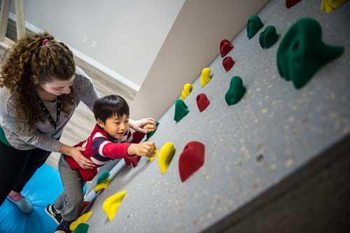 One of our rock walls being used in Sensory/Occupational Therapy