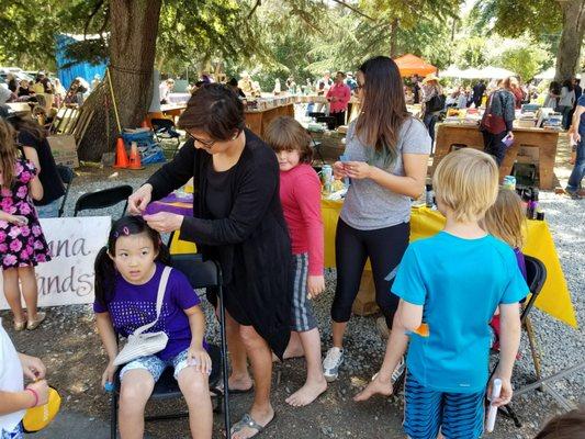 Bling strings and sprat on hair color at Peninsula School Spring Fair