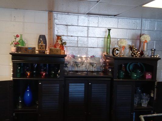 Glass vases and jars and all kinds of glasses and Decor, we have some furniture and flowers. Come see what we have!!