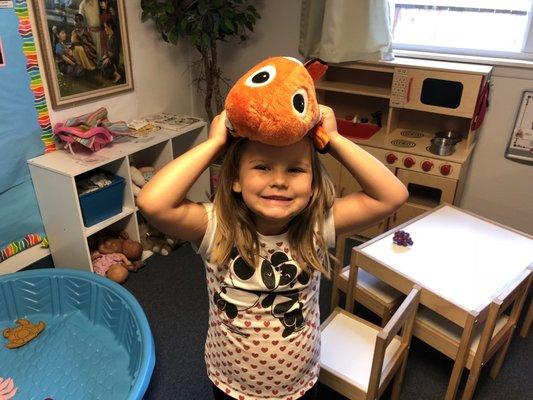 A PreKindergartner loving her play time in the center.