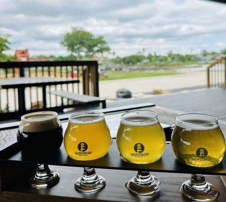 Flight with playground in background. We loved sunny IPA grapefruit!