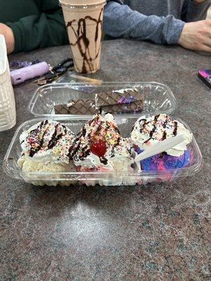 Banana split, chocolate milkshake in the back