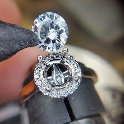 Setting the last diamond in the center in this beautiful platinum engagement ring.