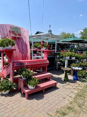 Photo Op in the big pink Adirondack chair!