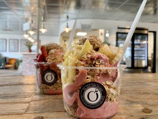 Strawberry smoothie bowl with pineapple on top; Strawberry smoothie bowl with strawberries on top