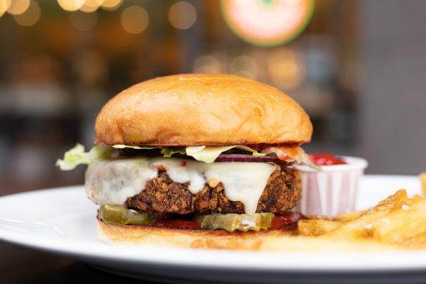 Black bean burger, pepper jack, lettuce, onion, pickles, and chipotle BBQ sauce on our house-made bun