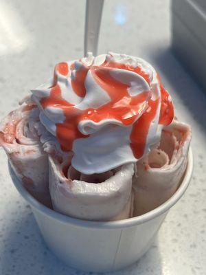 Namaste (fresh strawberries and NY cheesecake bites) with whipped cream and strawberry sauce