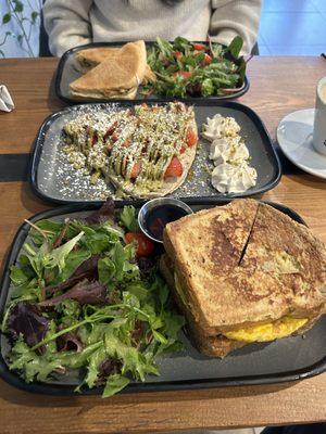 French toast breakfast sandwich with bacon, pistachio crepe(add strawberries), and a chicken Gouda panini with side salads.