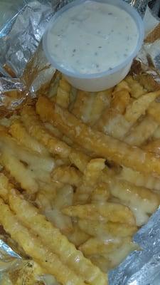 Cheese fries with a side of ranch