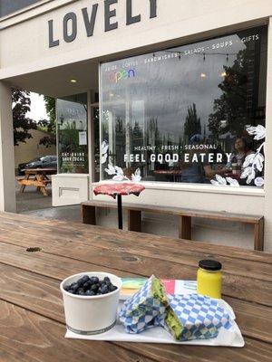 My order on the picnic table in front of the store