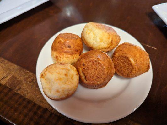 From Rodizio's website:  PÃO DE QUEIJO - Homemade Brazilian cheese bread made with traditional yucca flour and a blend of cheeses.