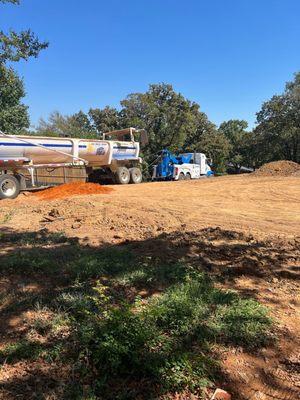 Dallas Towing pulling 20-Tom dump truck out