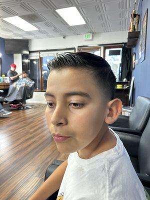 Evan combo cut combover/taper cut.  He always like to try new style. He was happy with the outcome.