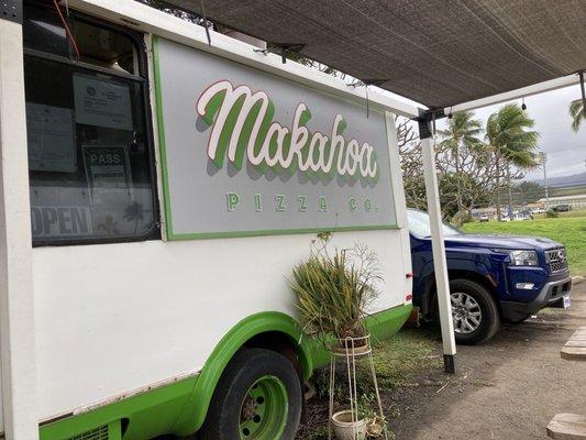 The sign at the front of the food truck.