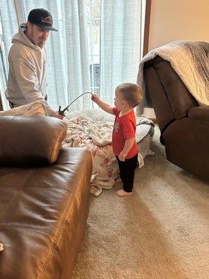 Technician showing my son the air compressor