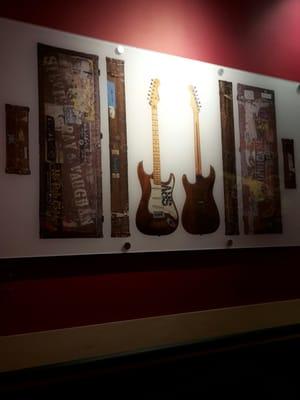 Just sitting here at Guitar Center listening to people learn different instruments, and looking at the cool art in the Lesson Area