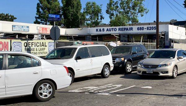 View from the street with sign showing "Official Brake & Lamp Testing Station"