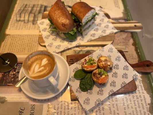 Three mini quiches, turkey, BLT sandwich and flat white coffee. Delicious!